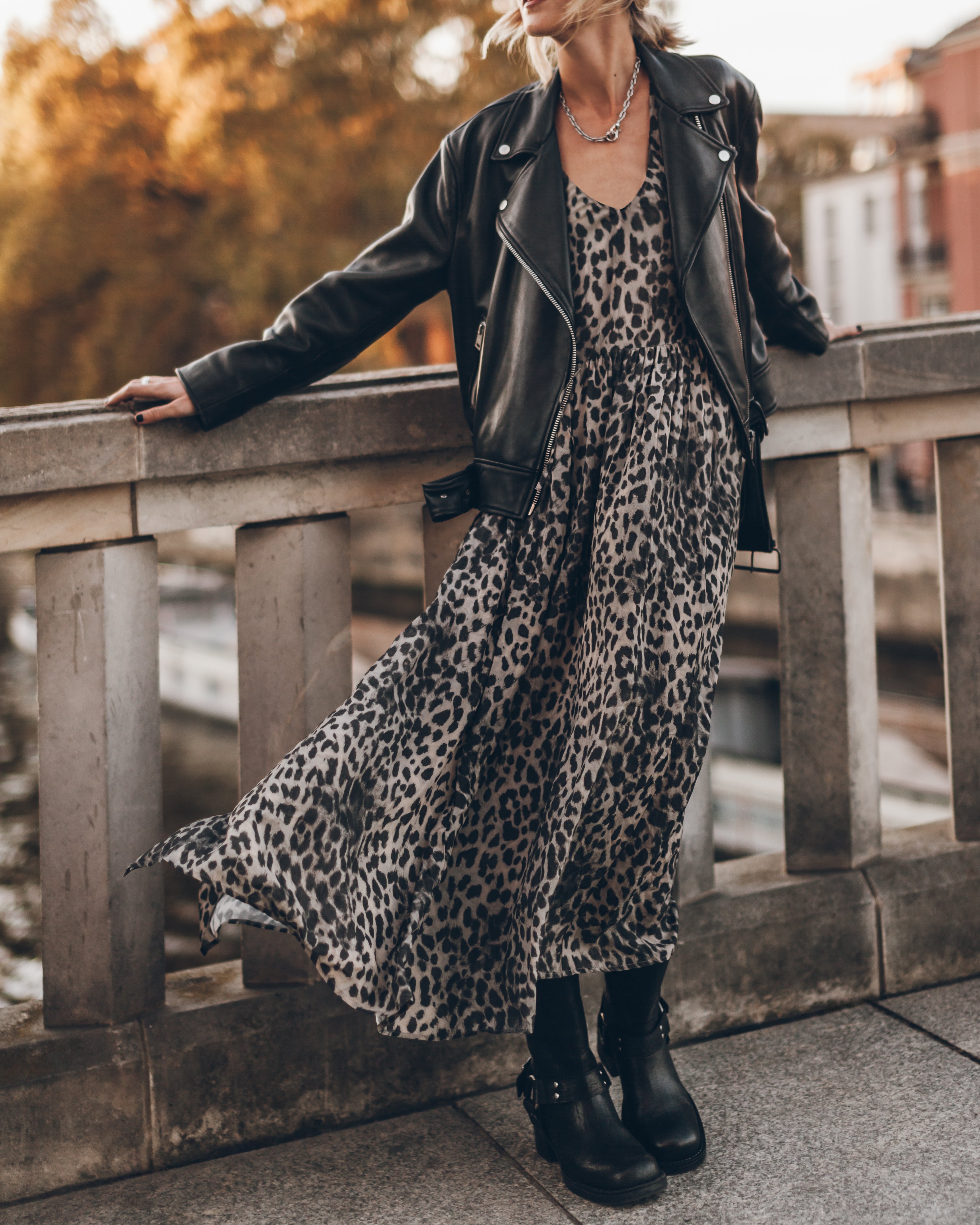 black dress with leather jacket Cuadra engraved The asymmetric front zip closure creates a distinctive silhouette 8 Ways to Style a