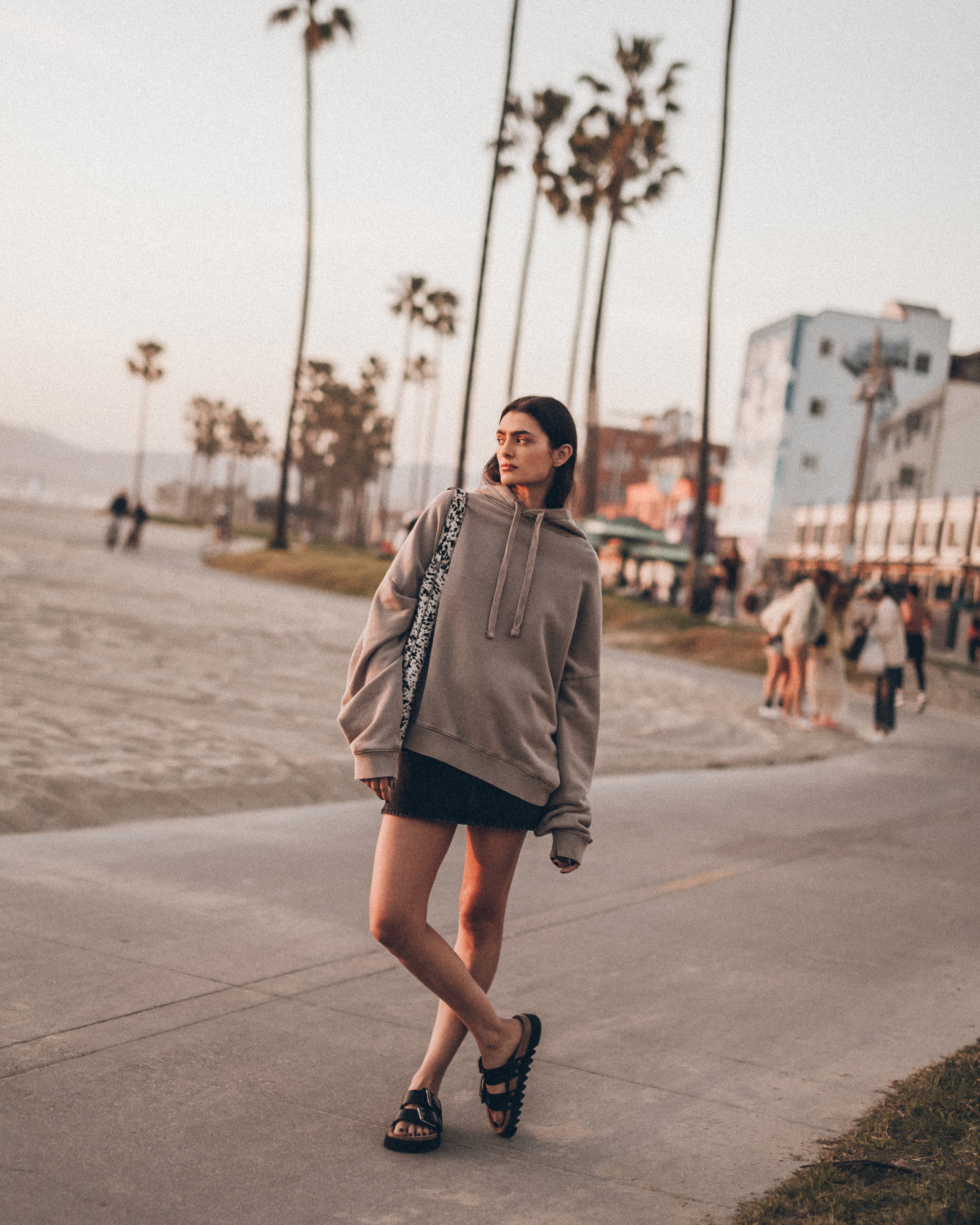 The Beige Oversized Hoodie The Black Denim Skirt The Black Leather Buckle Sandals Los Angeles Cal...