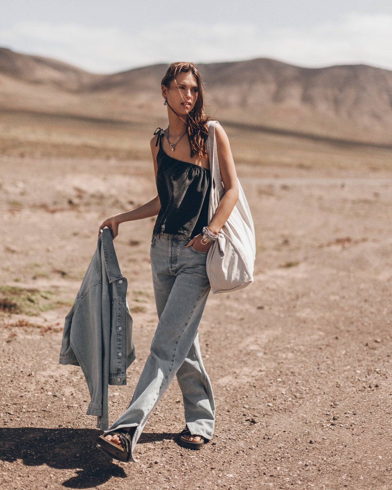 The Black Asymmetrical Top The Blue Straight Slit Jeans The Me Necklace The Light Large Canvas Ba...