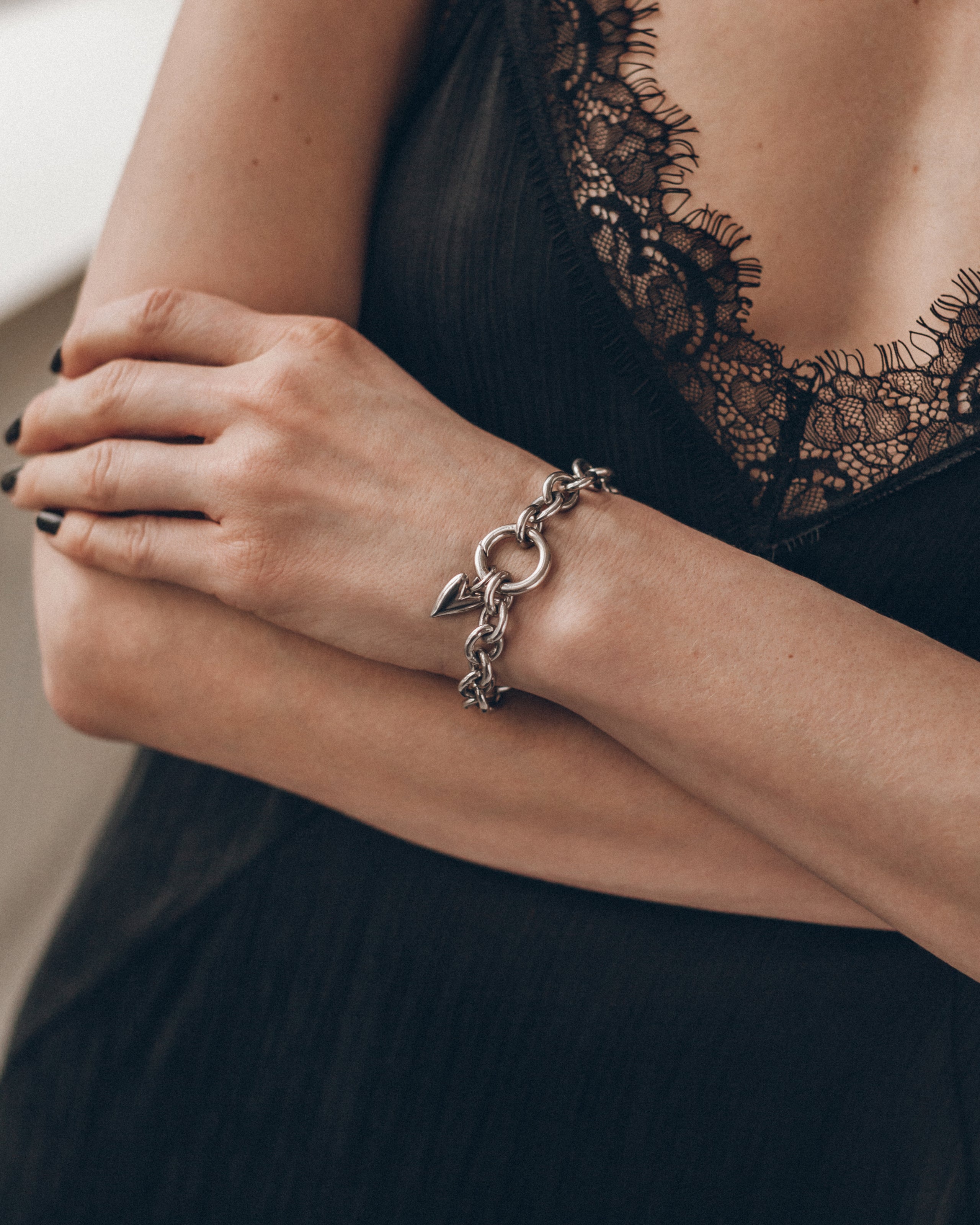 Heart charm with black dress and bracelet - romantic Valentine's look