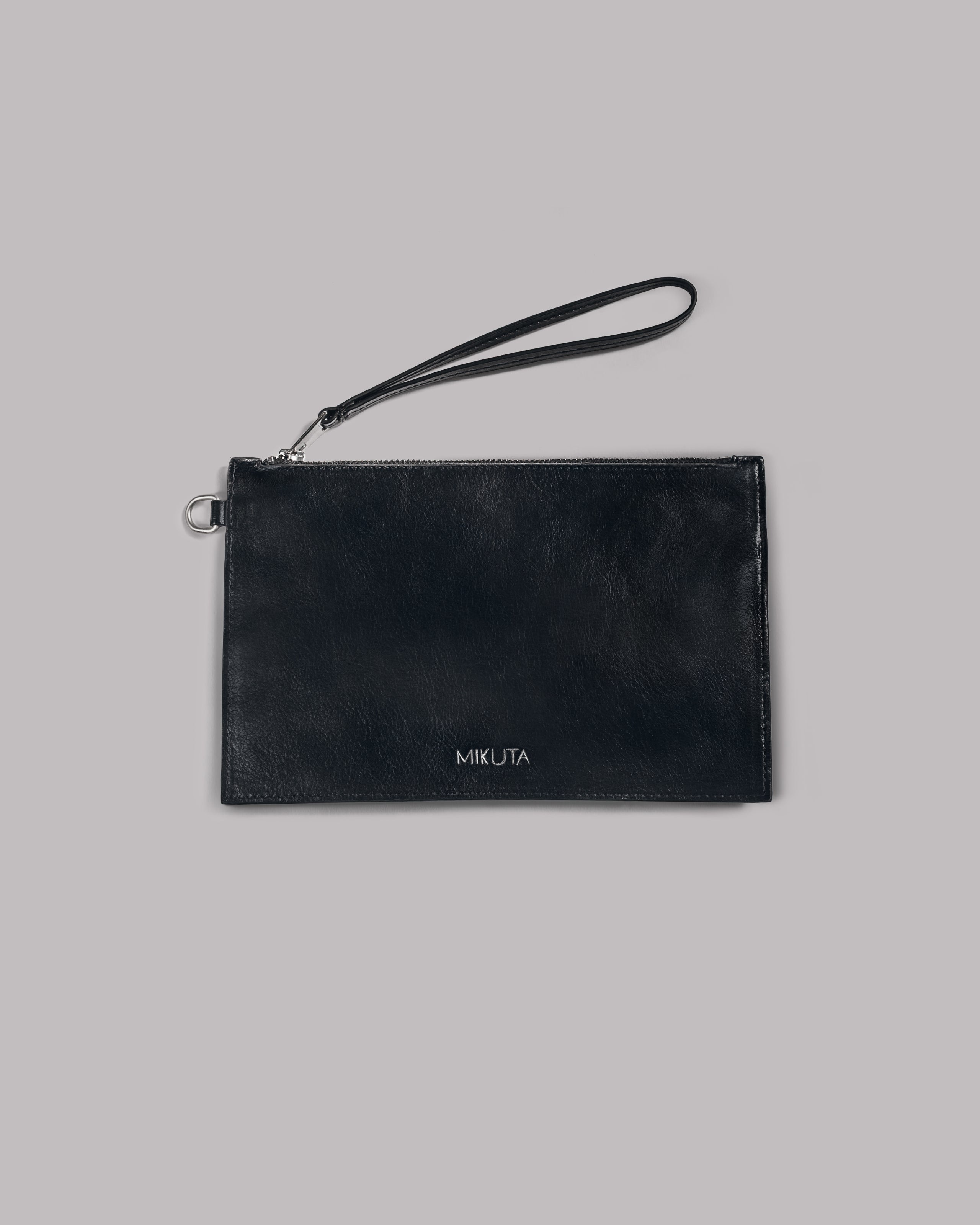 Black leather pouch with 'MIKUTA' branding on a gray background