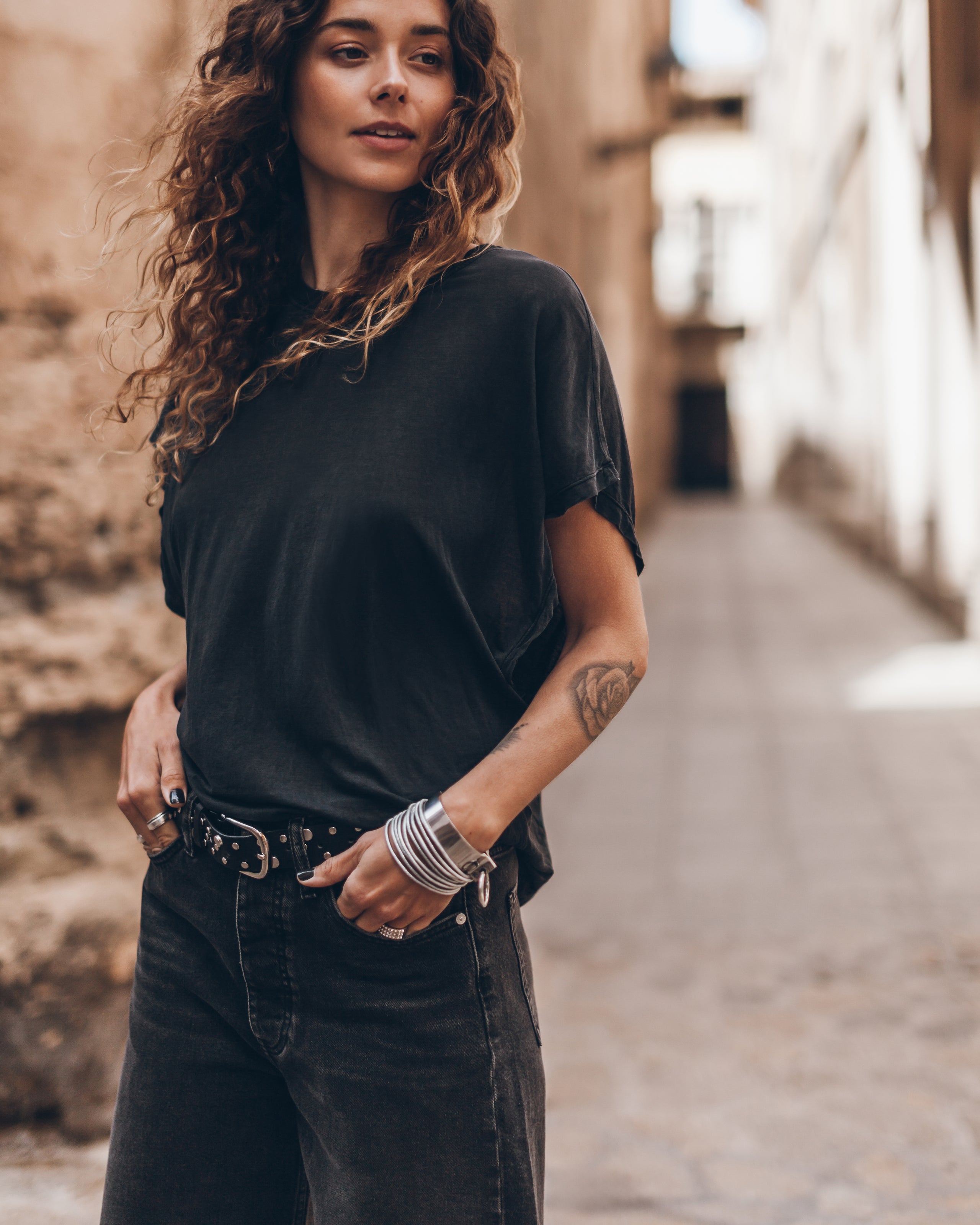 The Dark Thin Batwing Shirt The Black Denim Bermuda Shorts The Studded Belt - Product photo