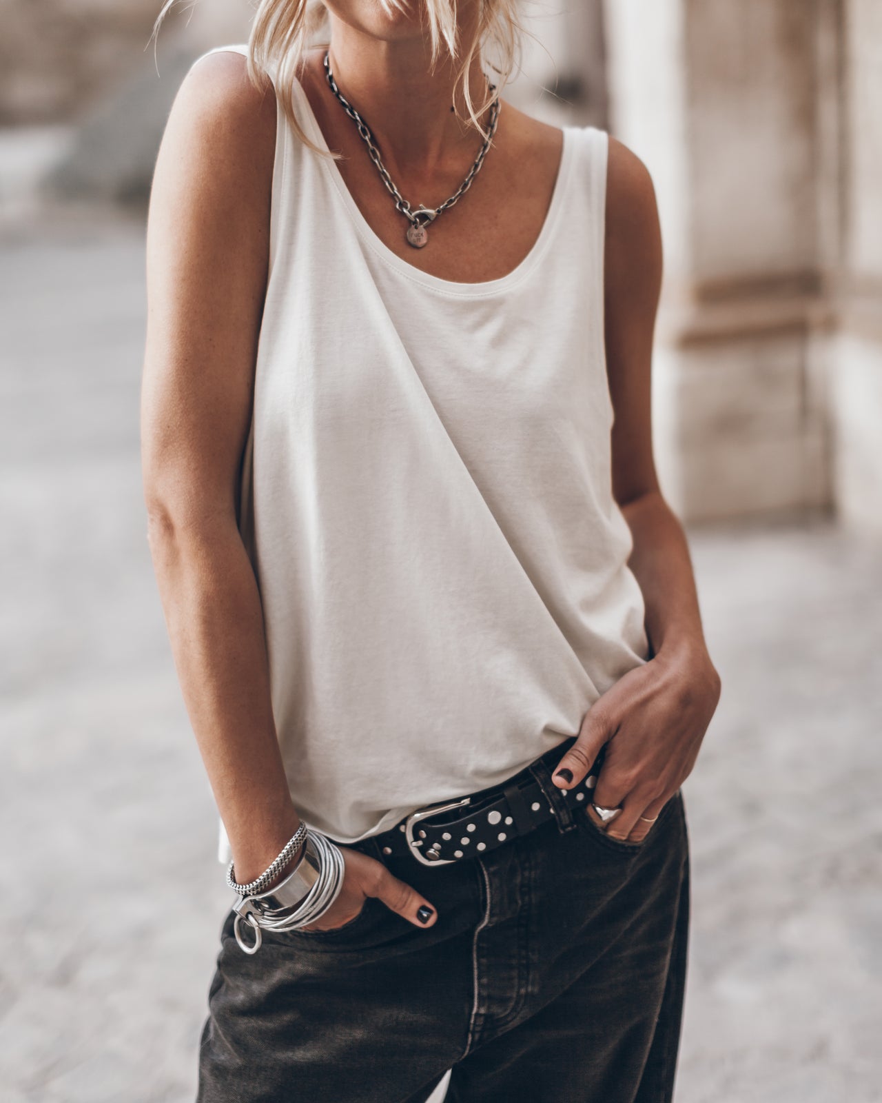 The White Low Back Base Tank Top The Black Baggy Jeans The Studded Belt The Large Cesta Bag - Pro...
