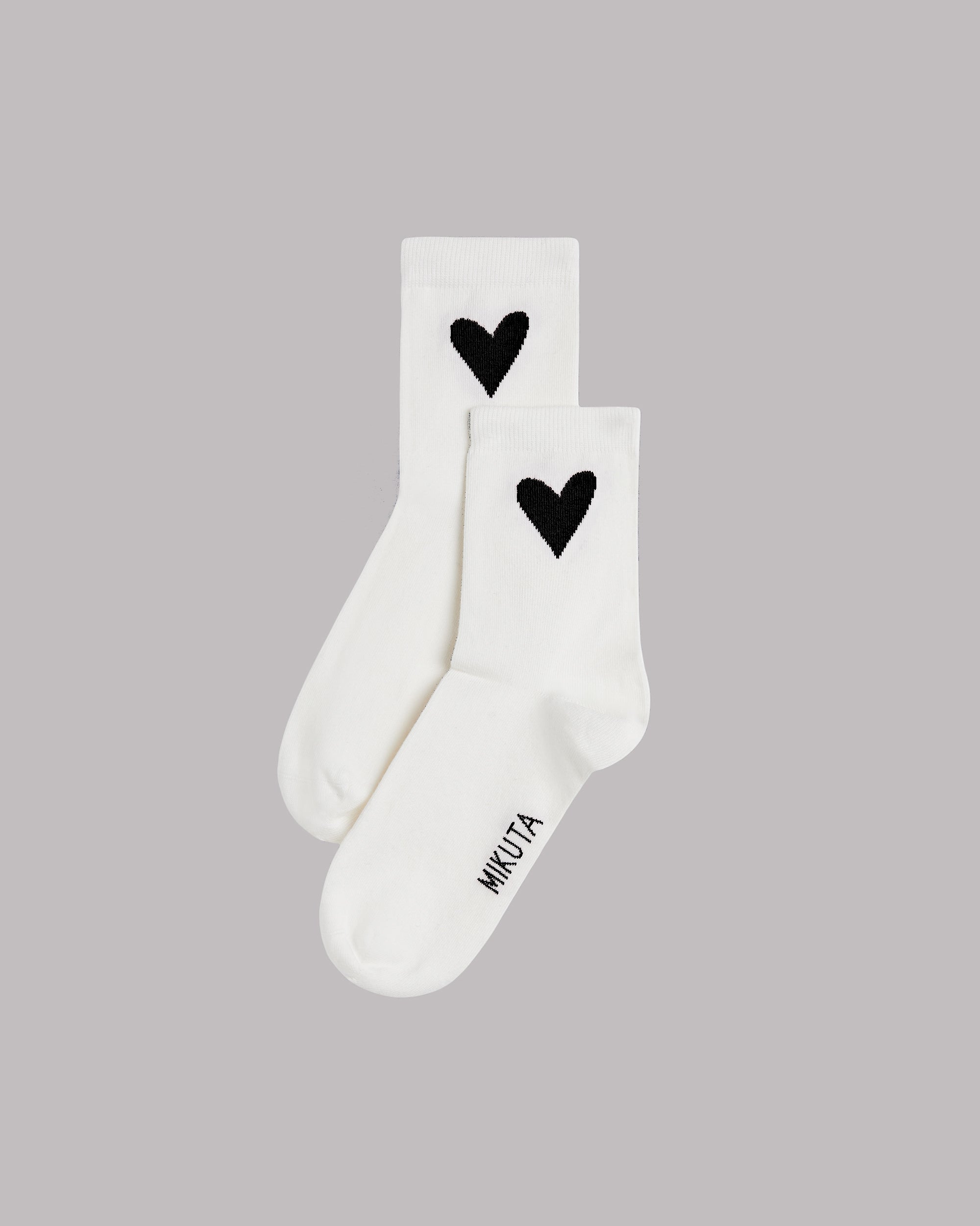 White socks with black heart design.