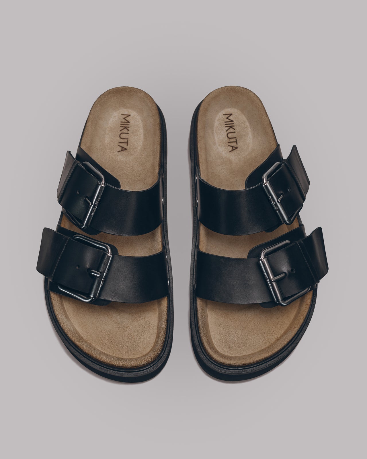 MIKUTA black leather buckle sandals product shot - strappy sandal design
