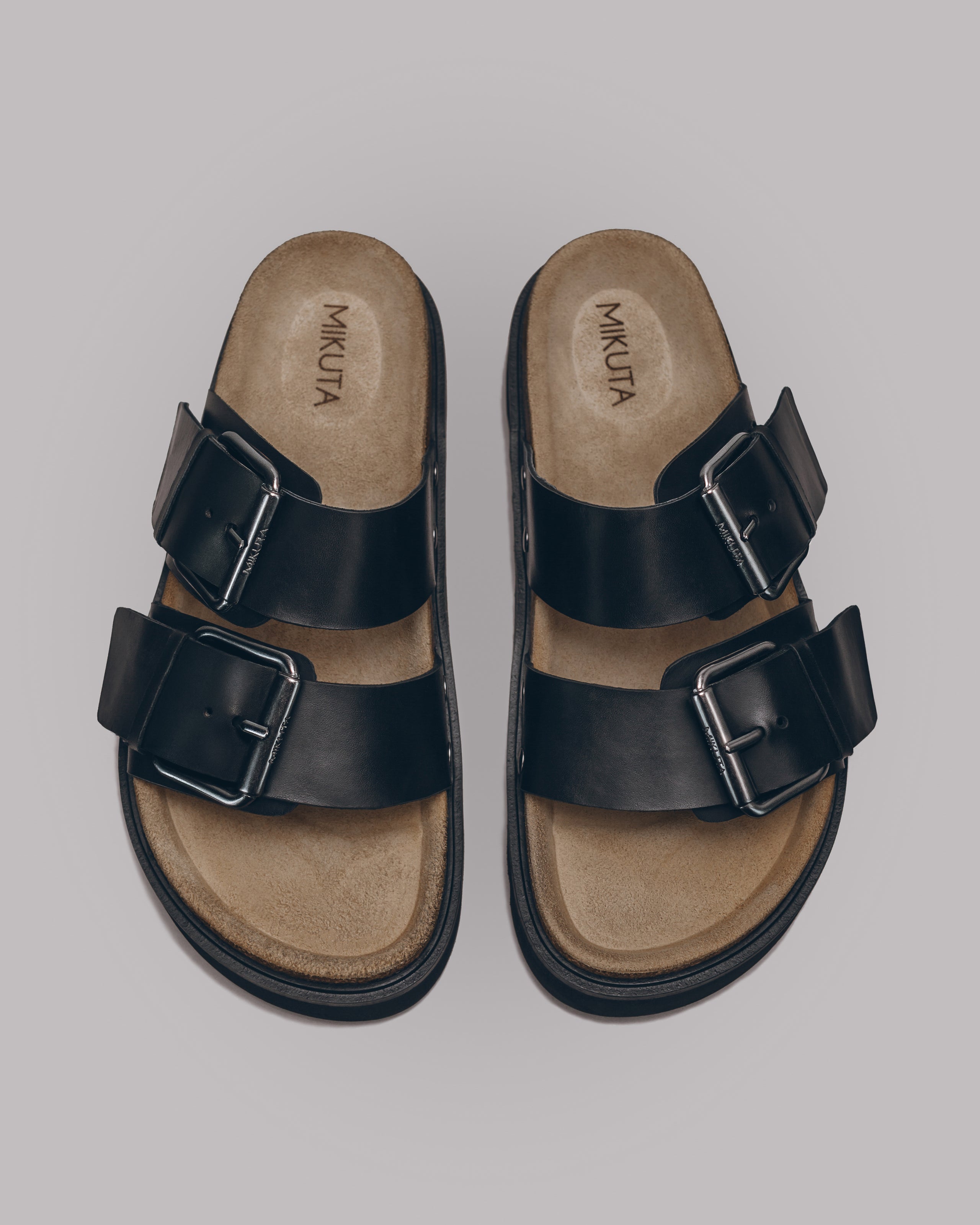 MIKUTA black leather buckle sandals product shot - strappy sandal design