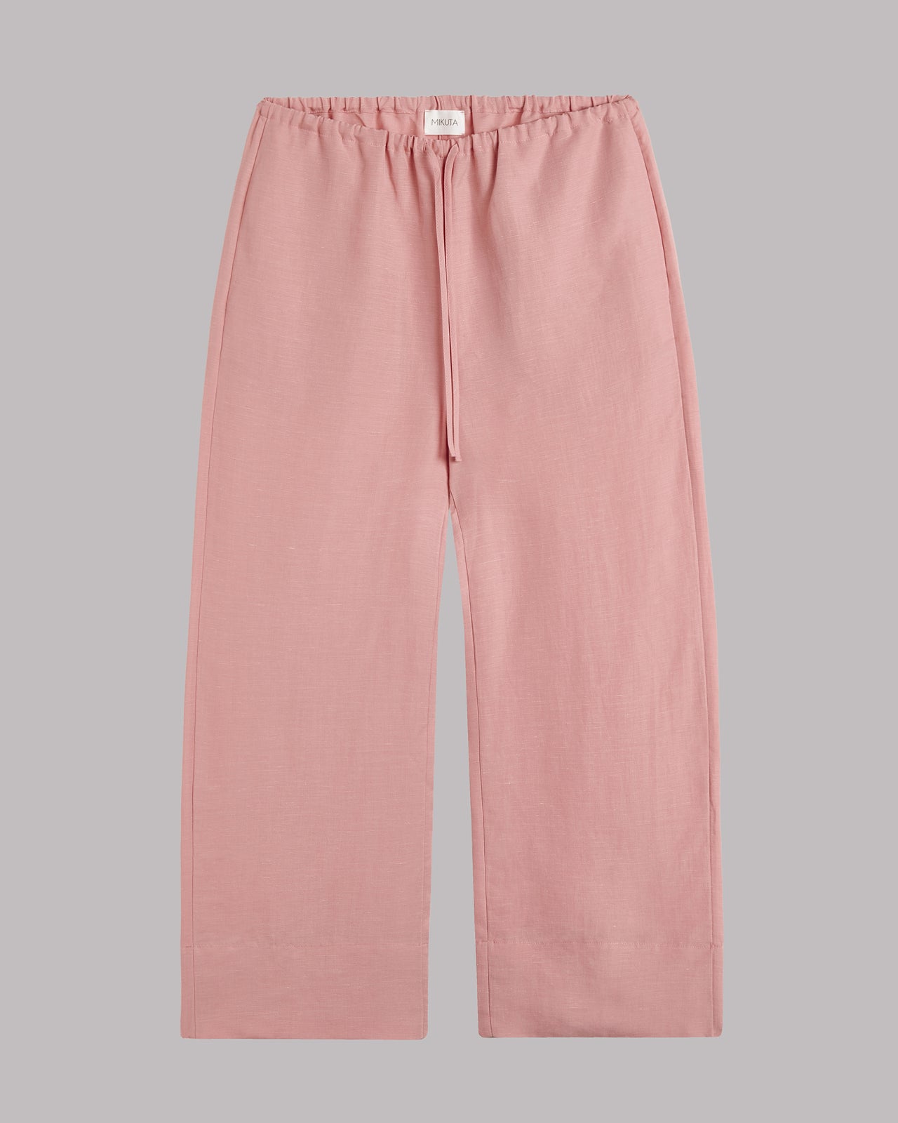 Blush cropped pants on a gray background