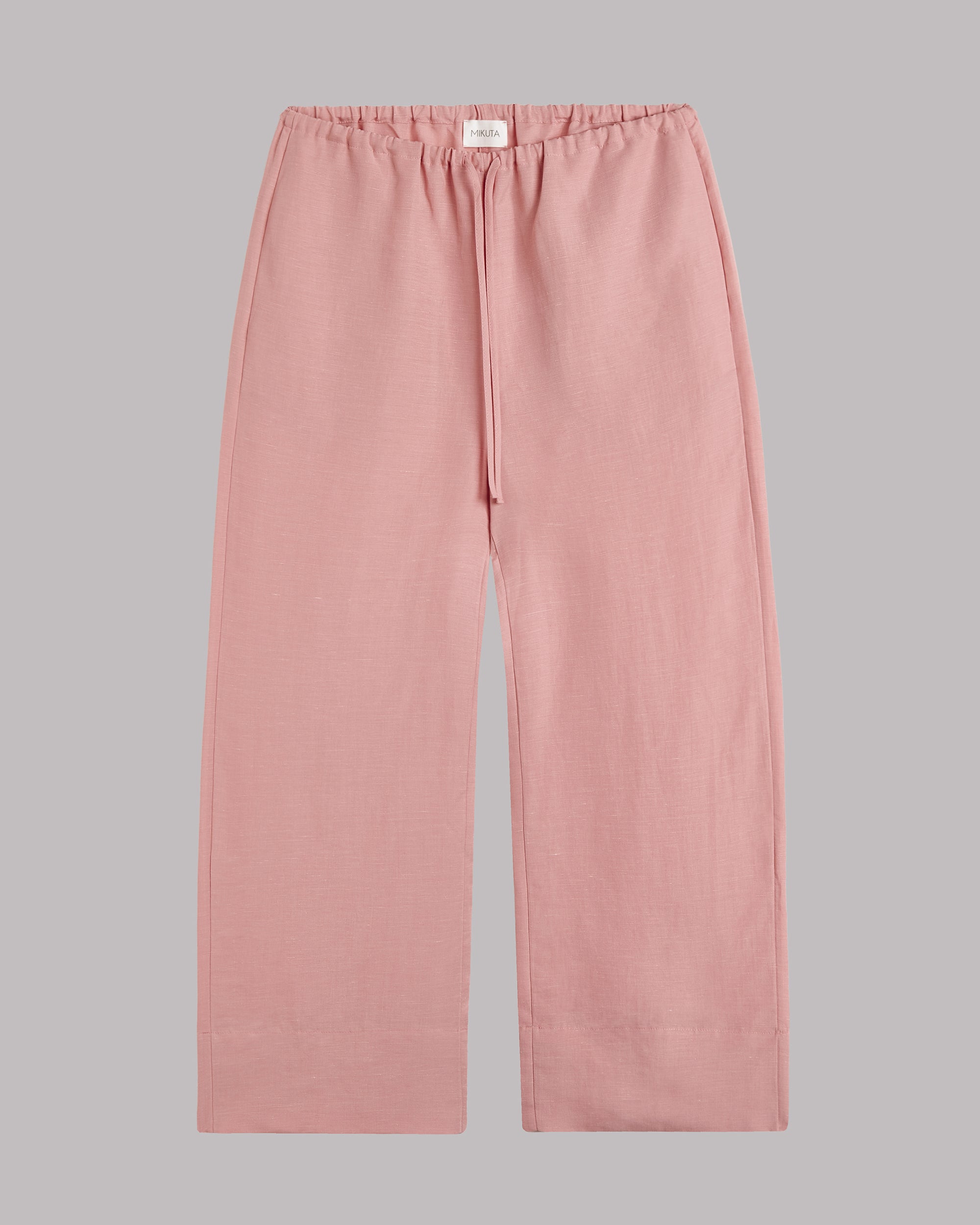 Blush cropped pants on a gray background