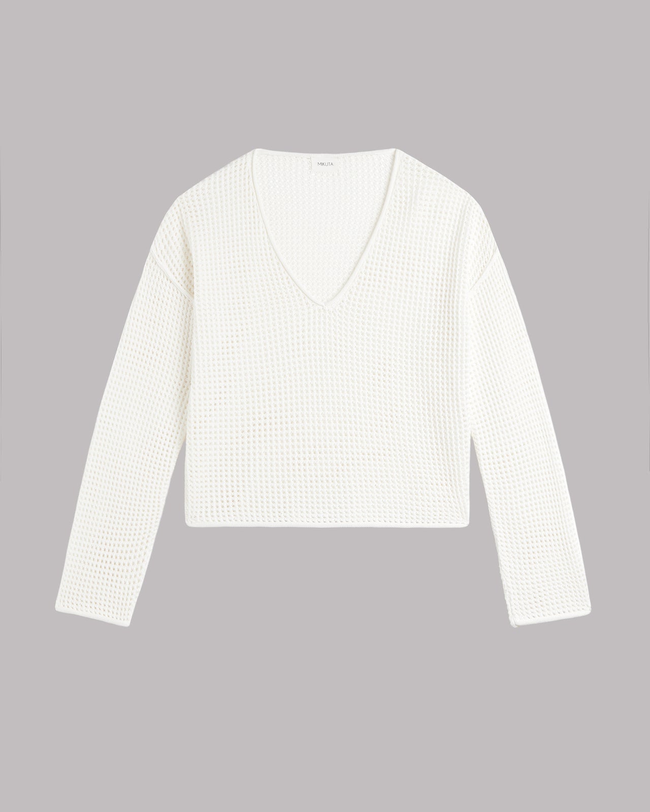 White long-sleeve shirt on a gray background