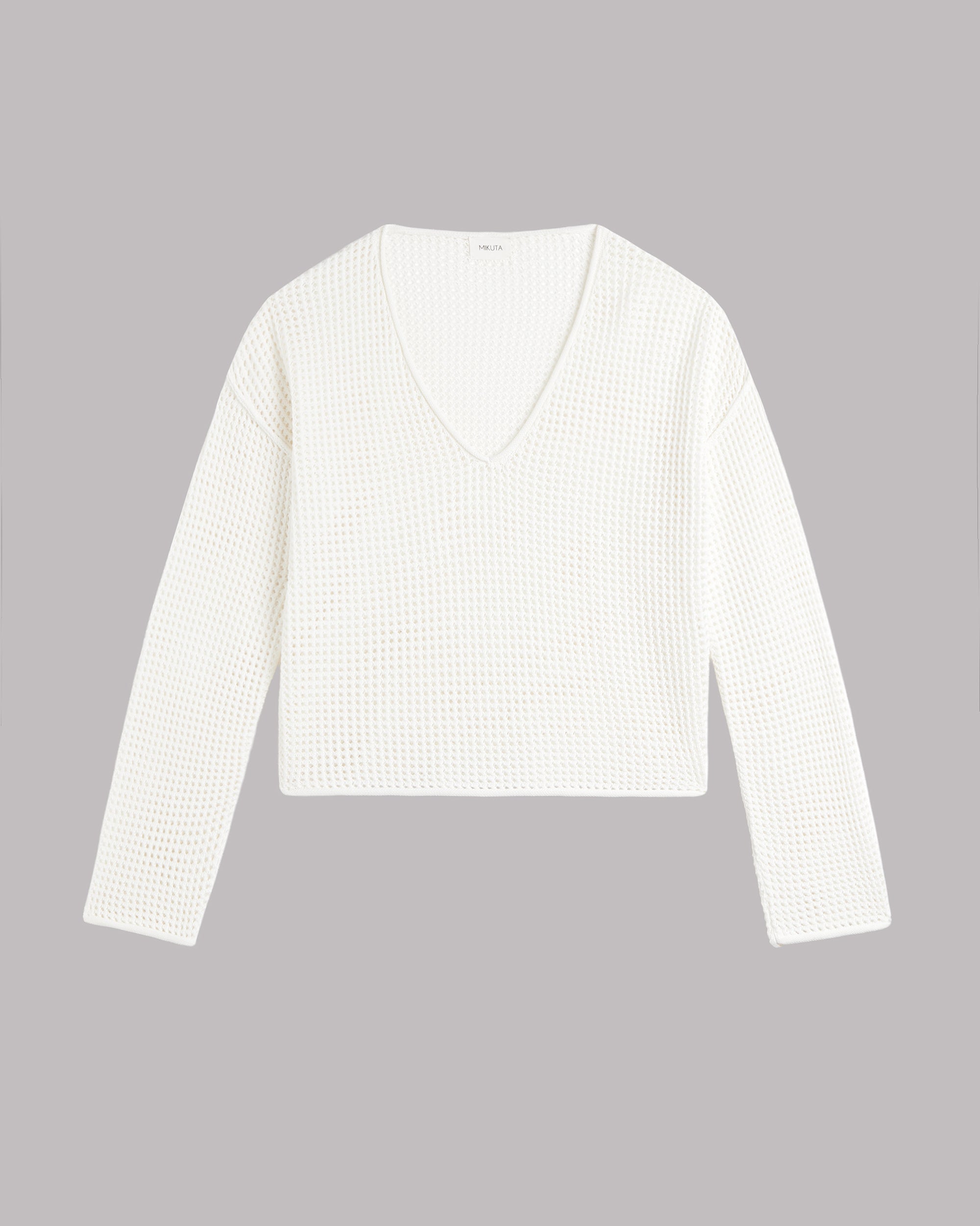 White long-sleeve shirt on a gray background