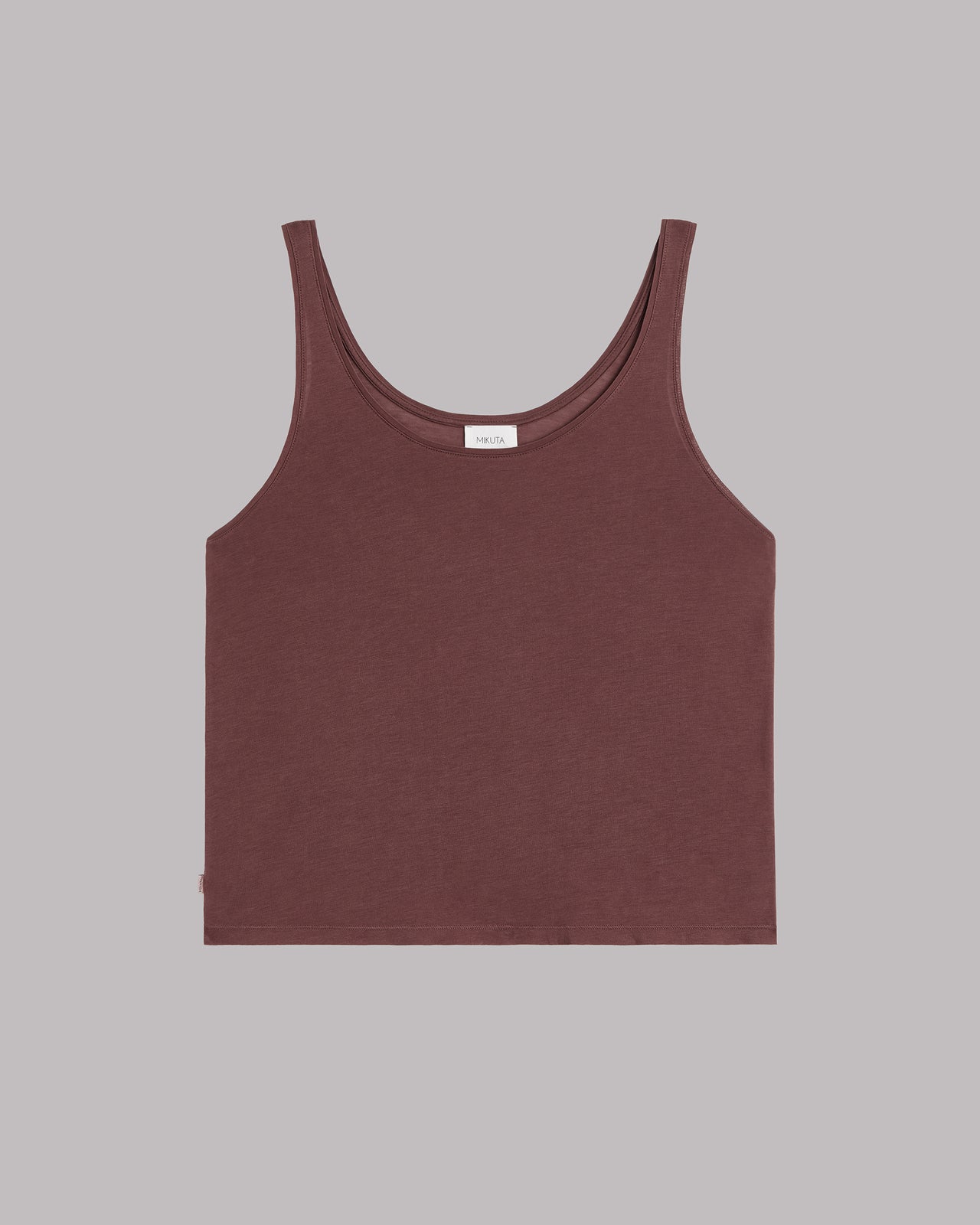 Brown tank top on a gray background
