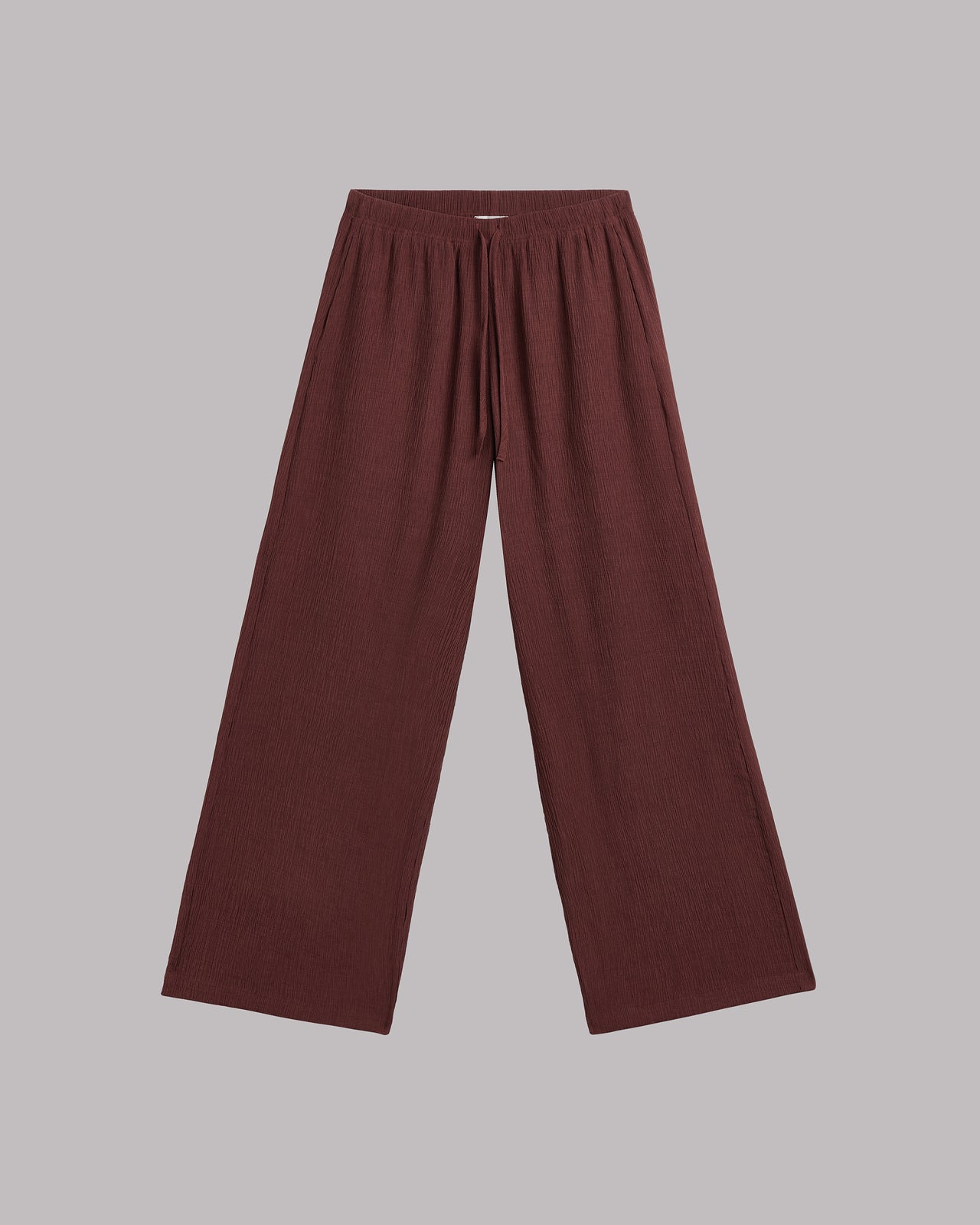 Russet wide-leg pants on a gray background