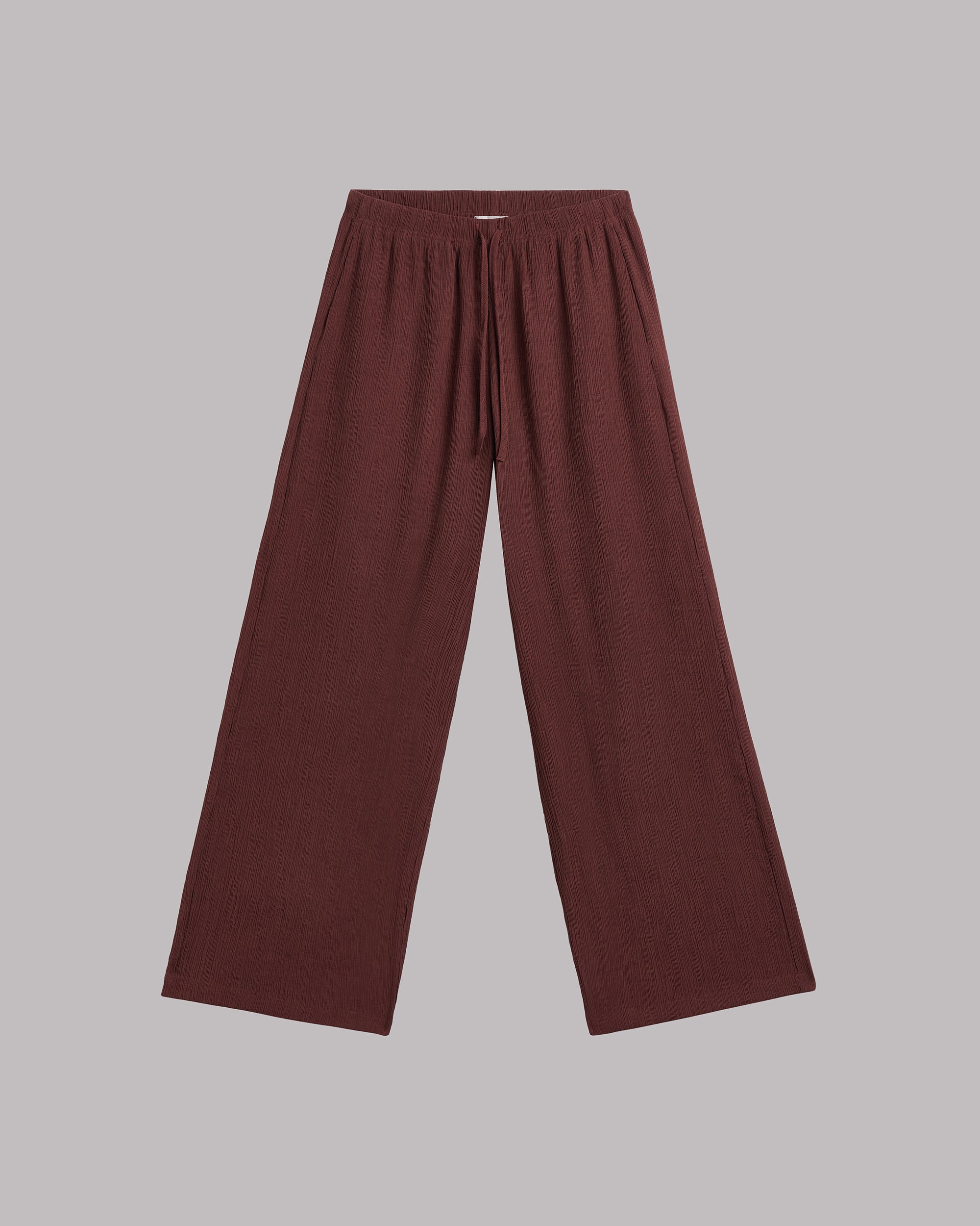 Russet wide-leg pants on a gray background