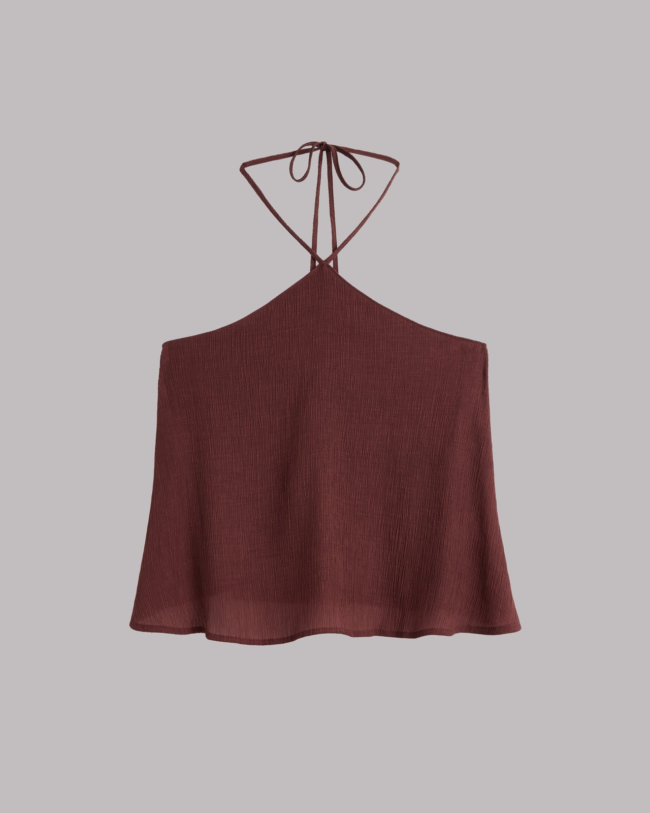 Russet halter top on a light gray background