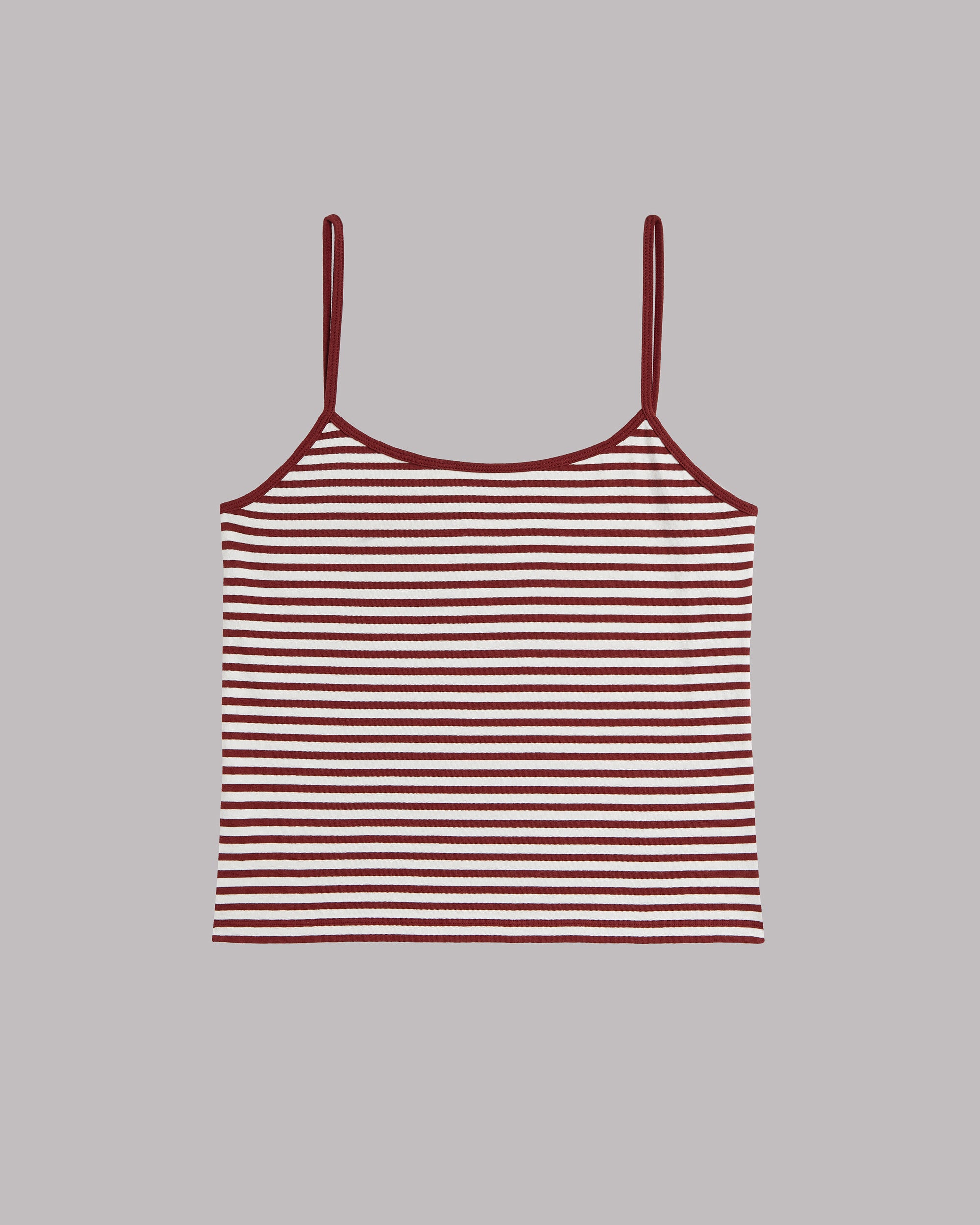 Striped tank top with thin straps on a gray background