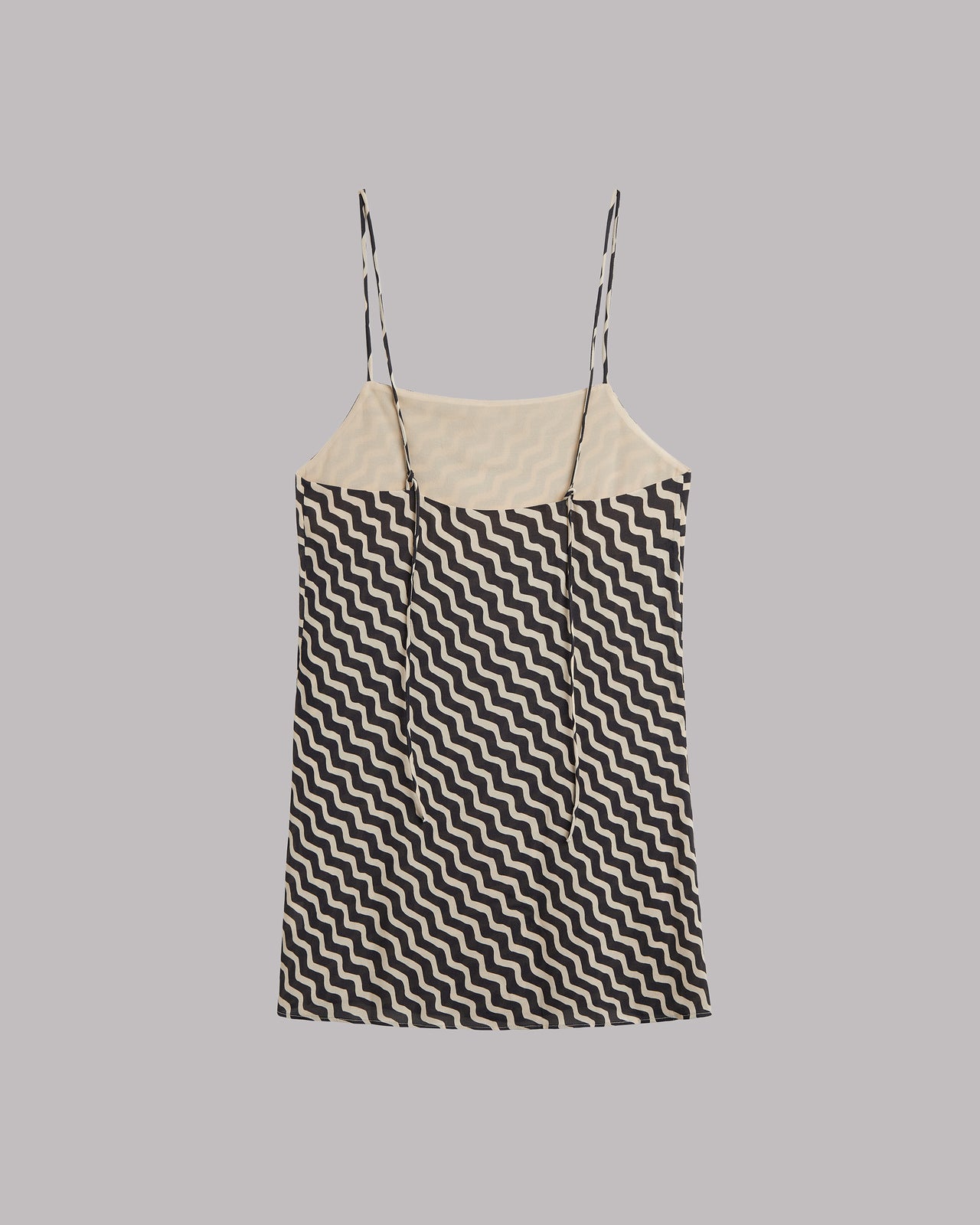 Sleeveless dress with Black and white zigzag pattern on a gray background