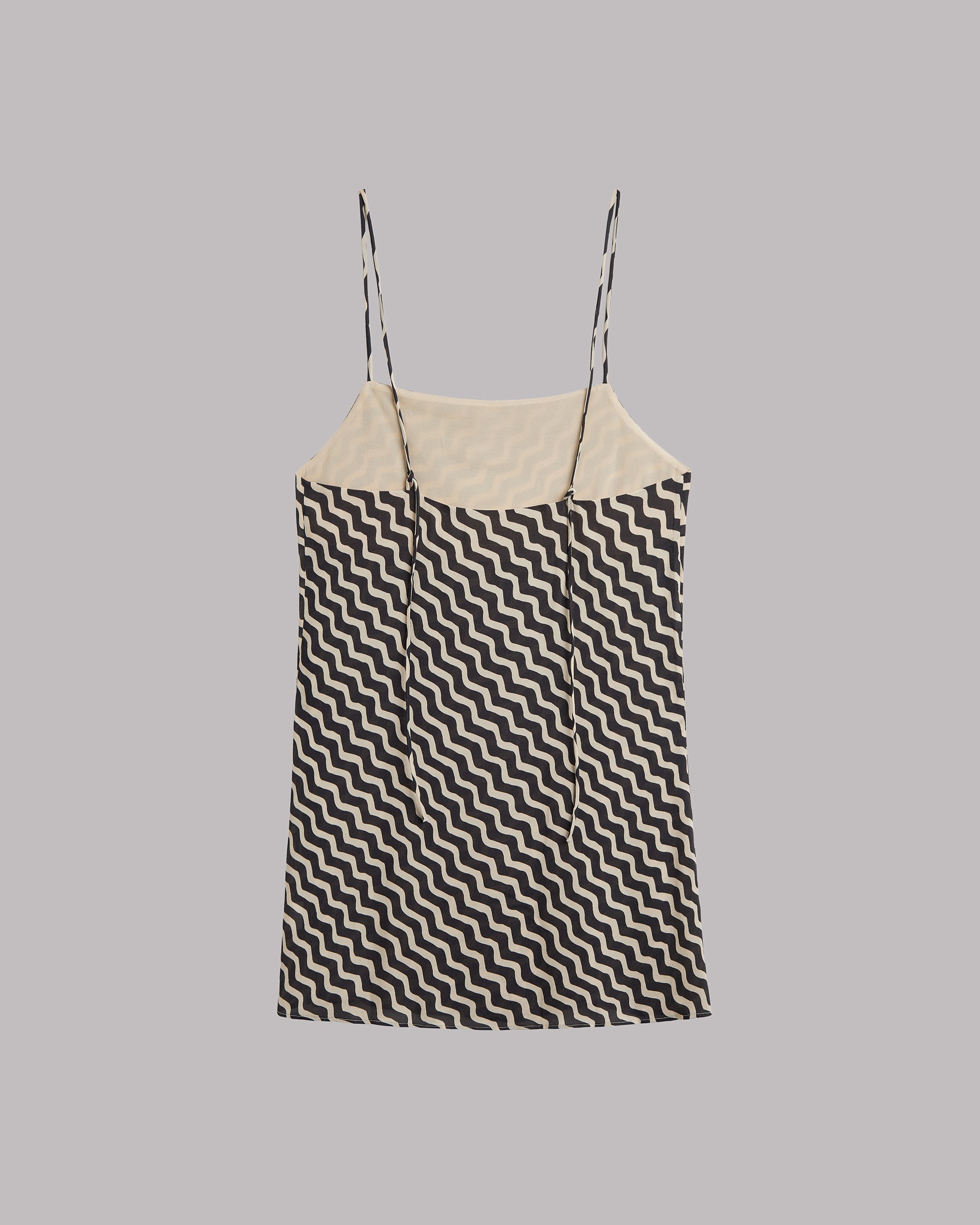 Sleeveless dress with Black and white zigzag pattern on a gray background