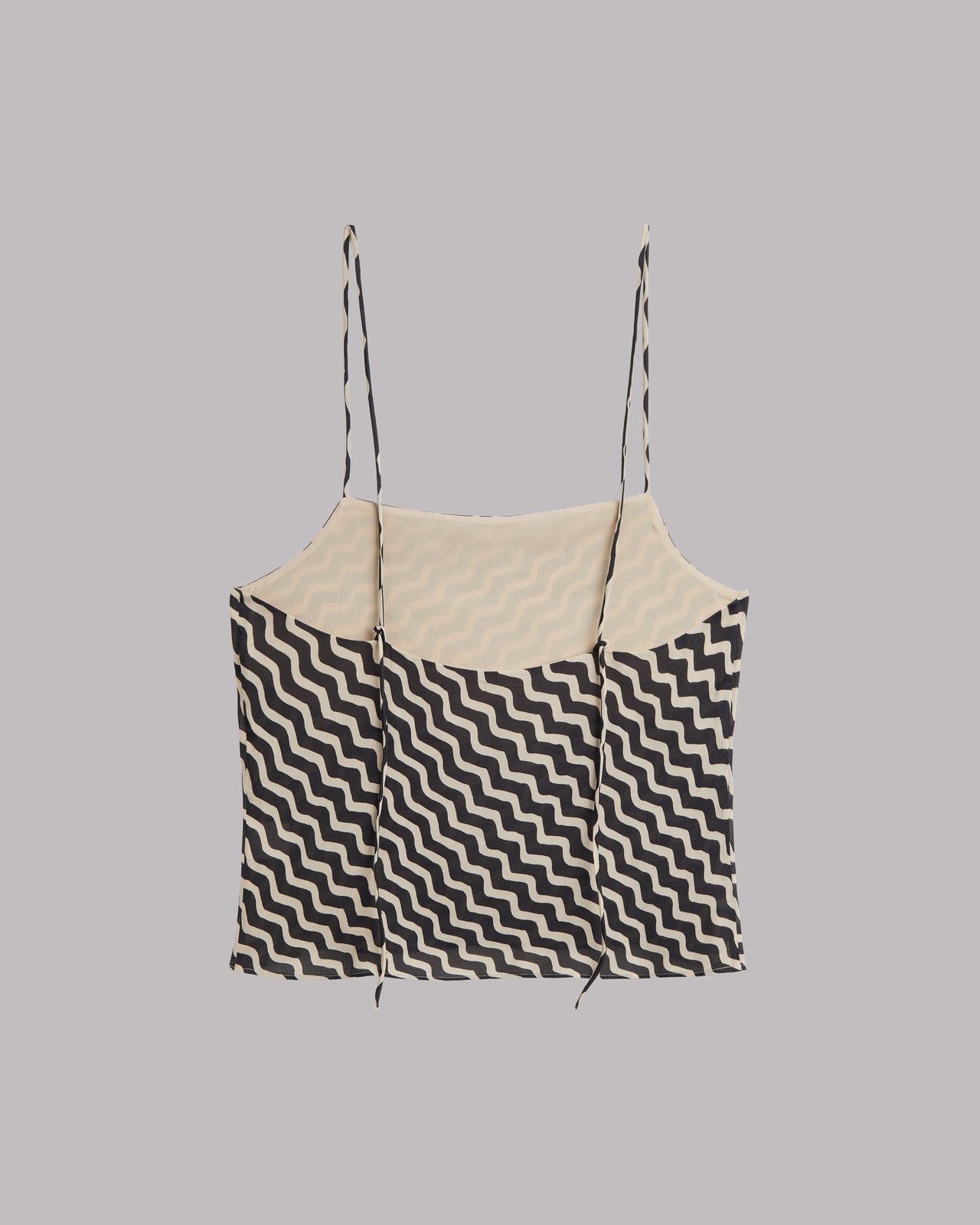 Black and white striped top on a gray background