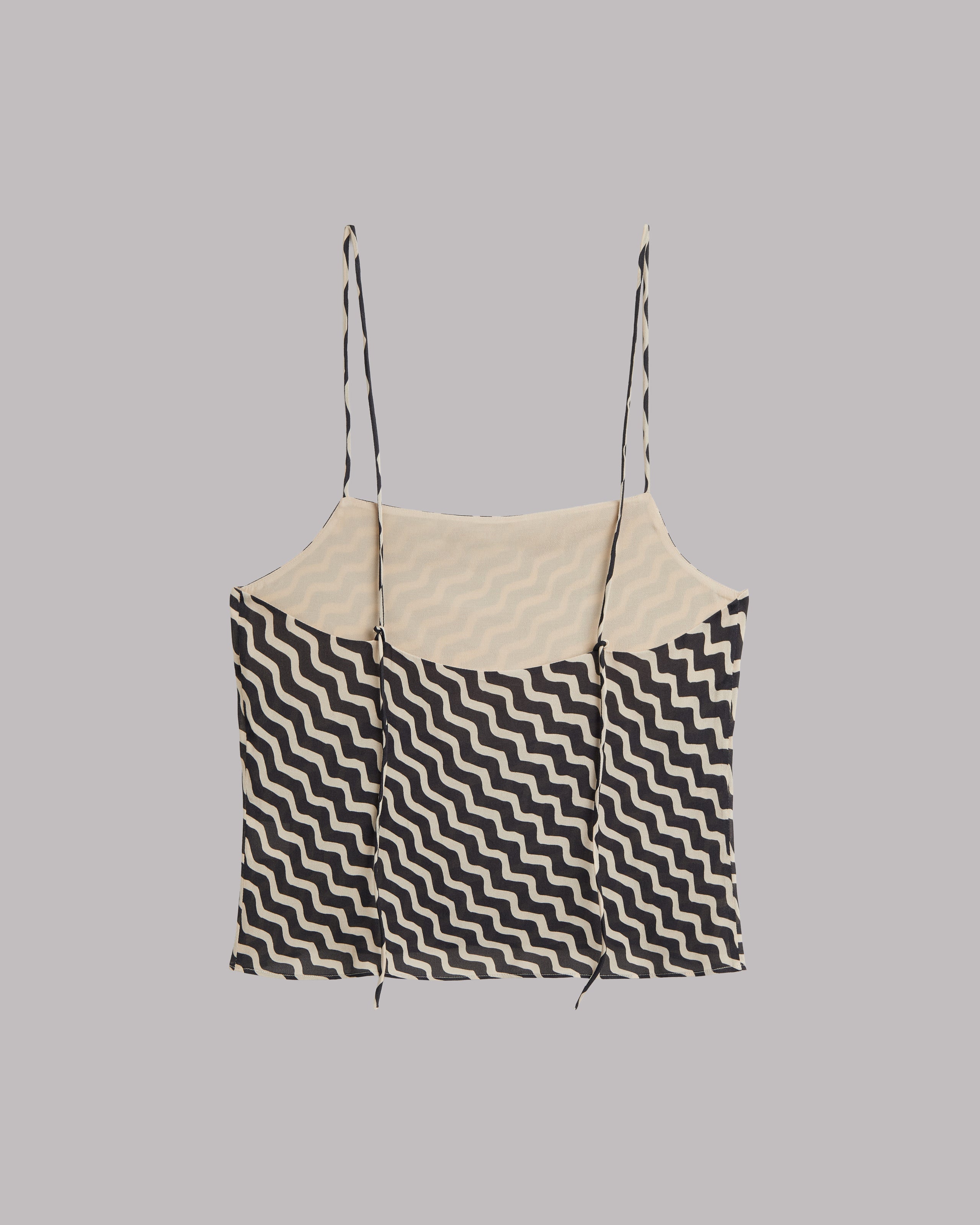 Black and white striped top on a gray background