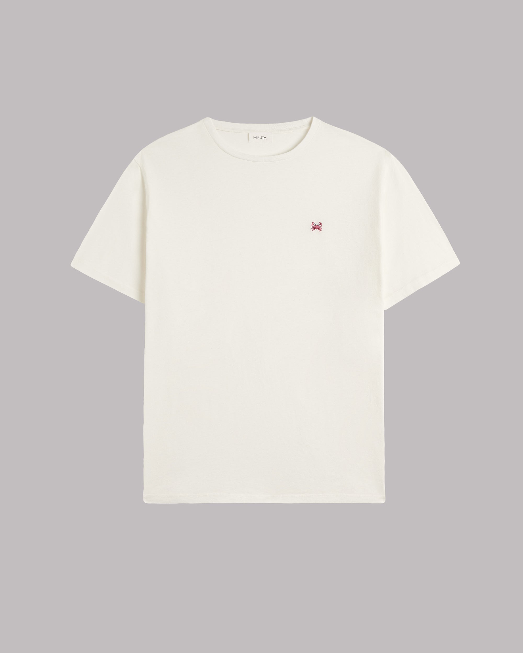 White t-shirt with a small crab icon on a gray background