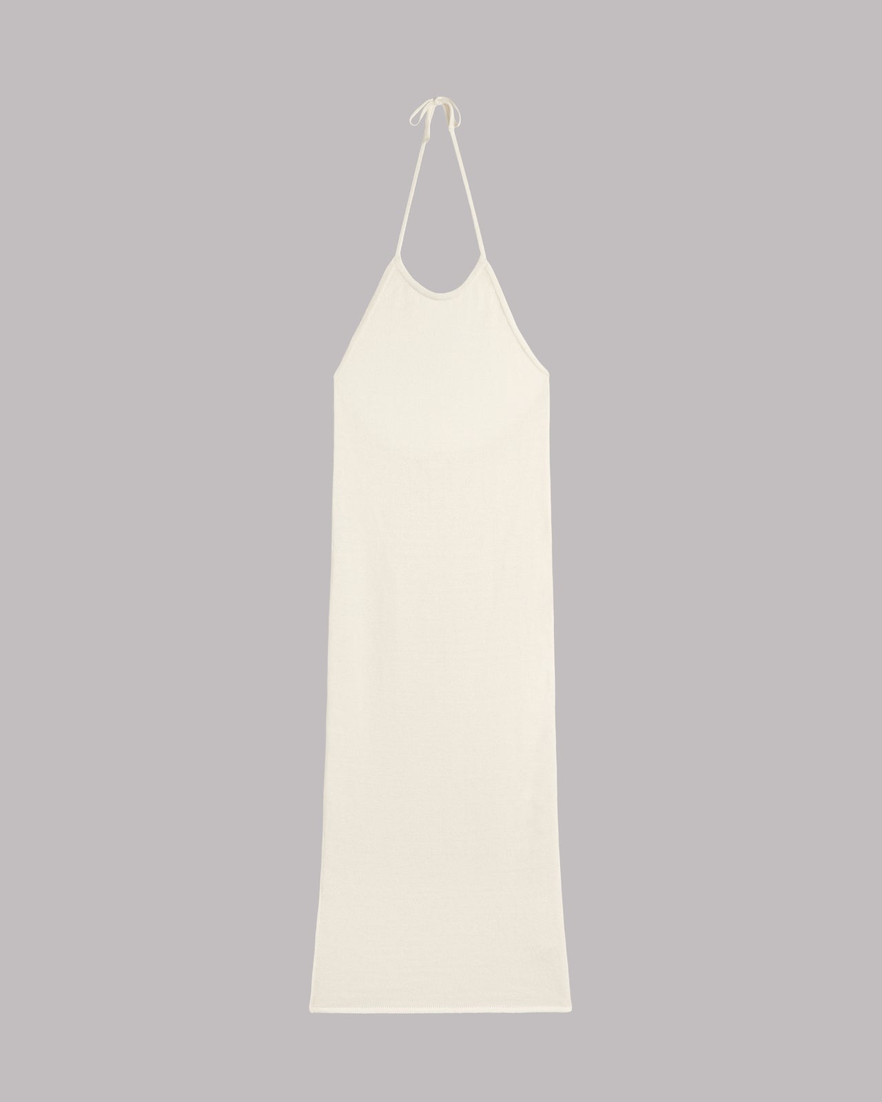 White slip dress on a gray background