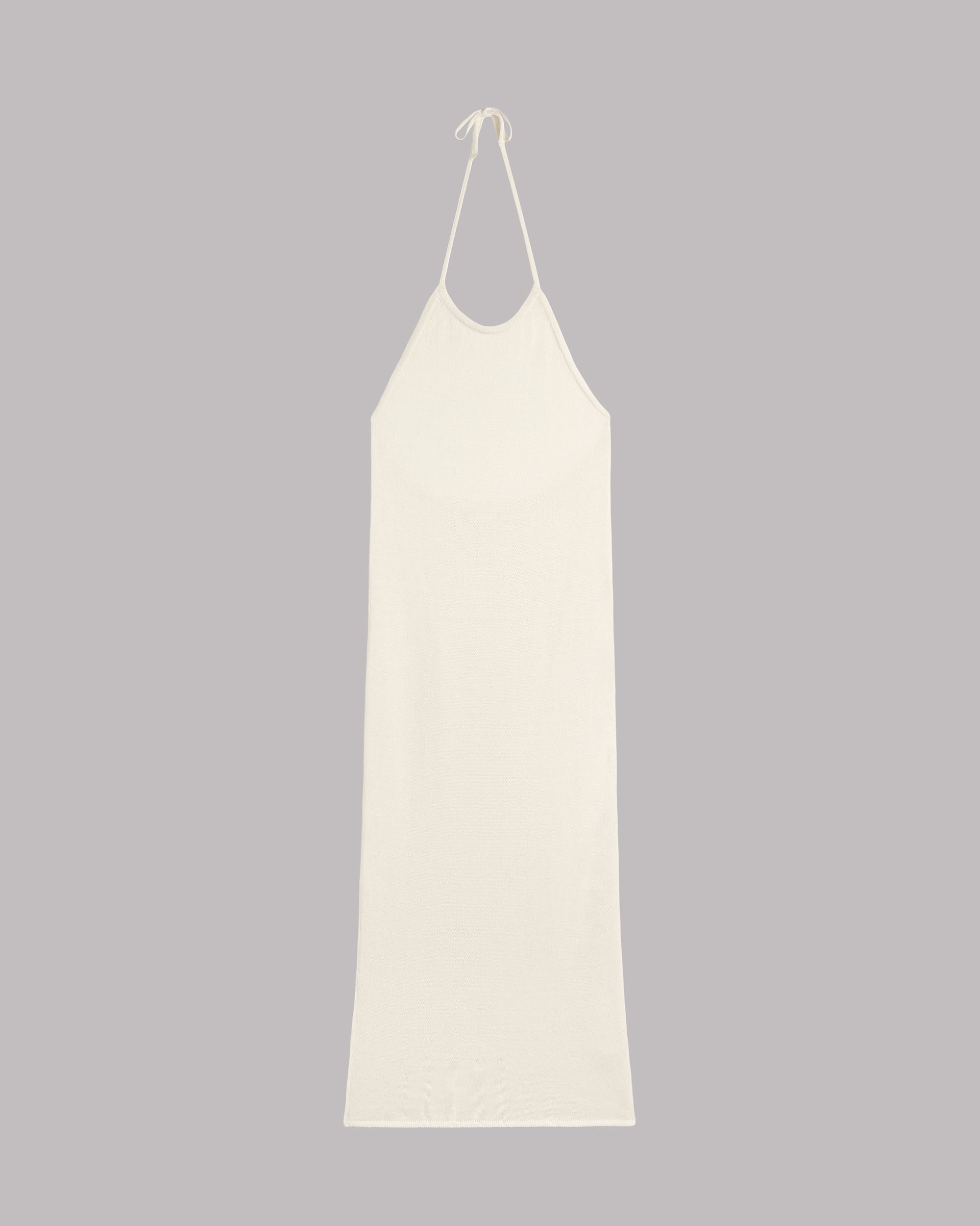 White slip dress on a gray background