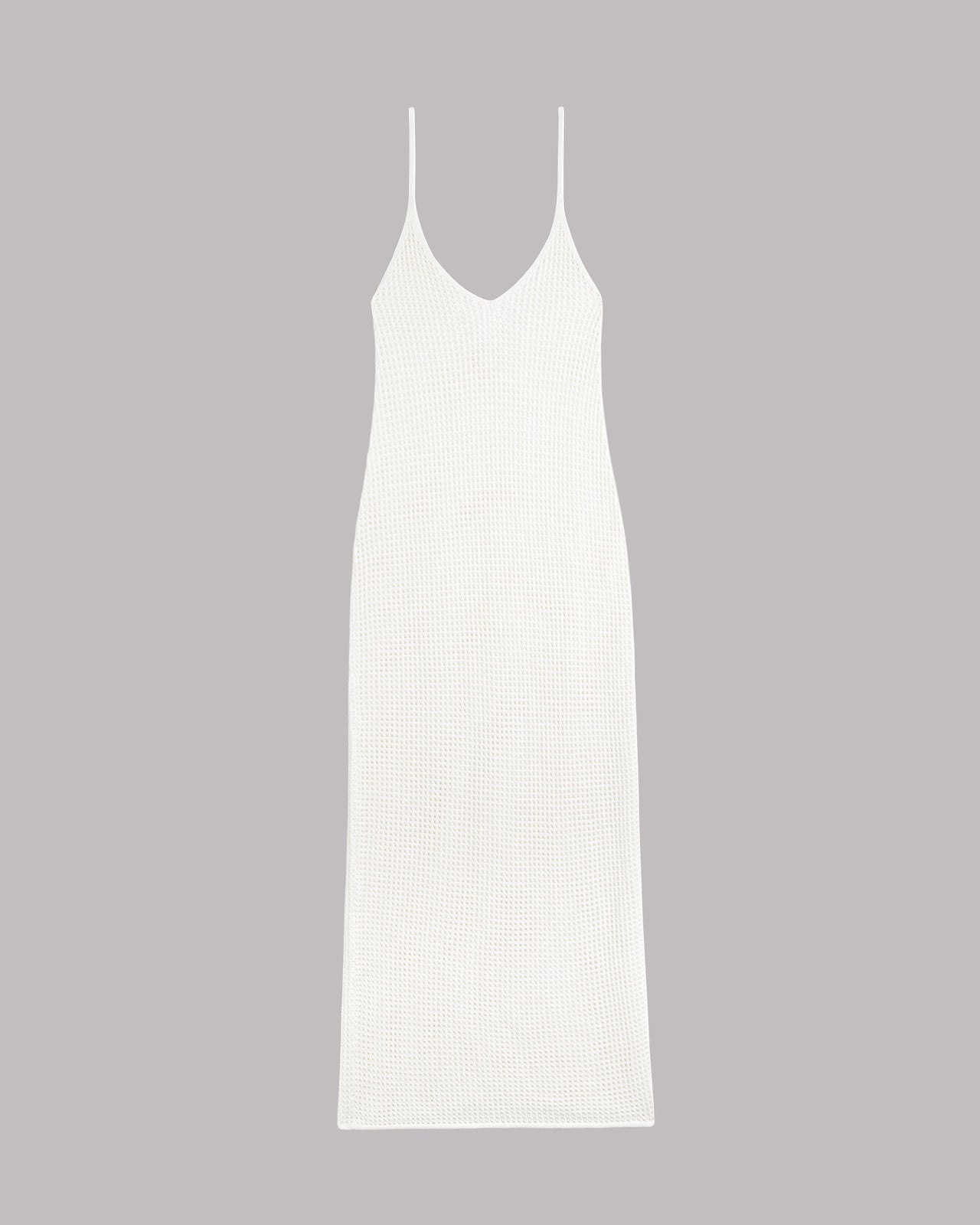 White slip knitted dress on a gray background