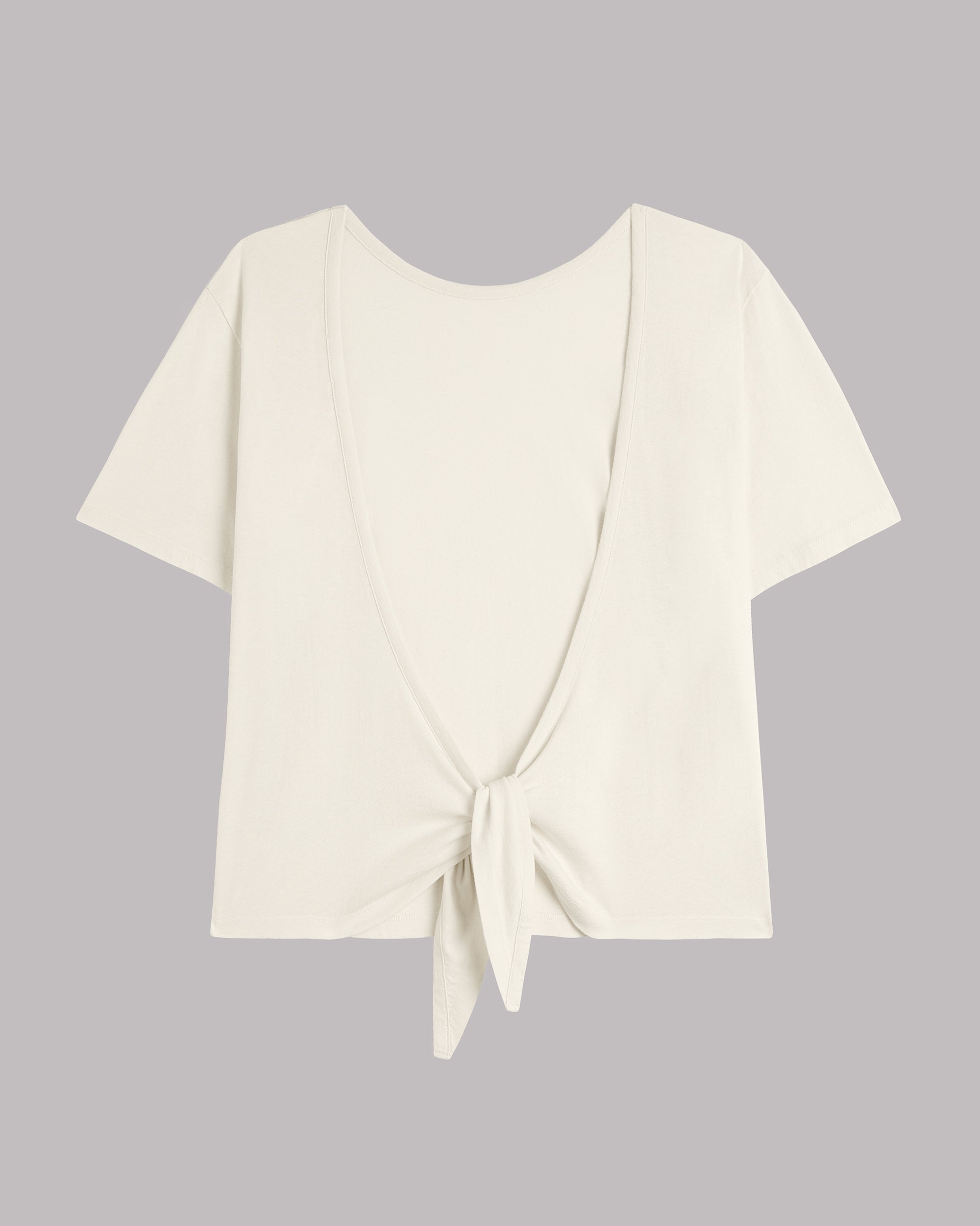 White top with a knot detail on a gray background