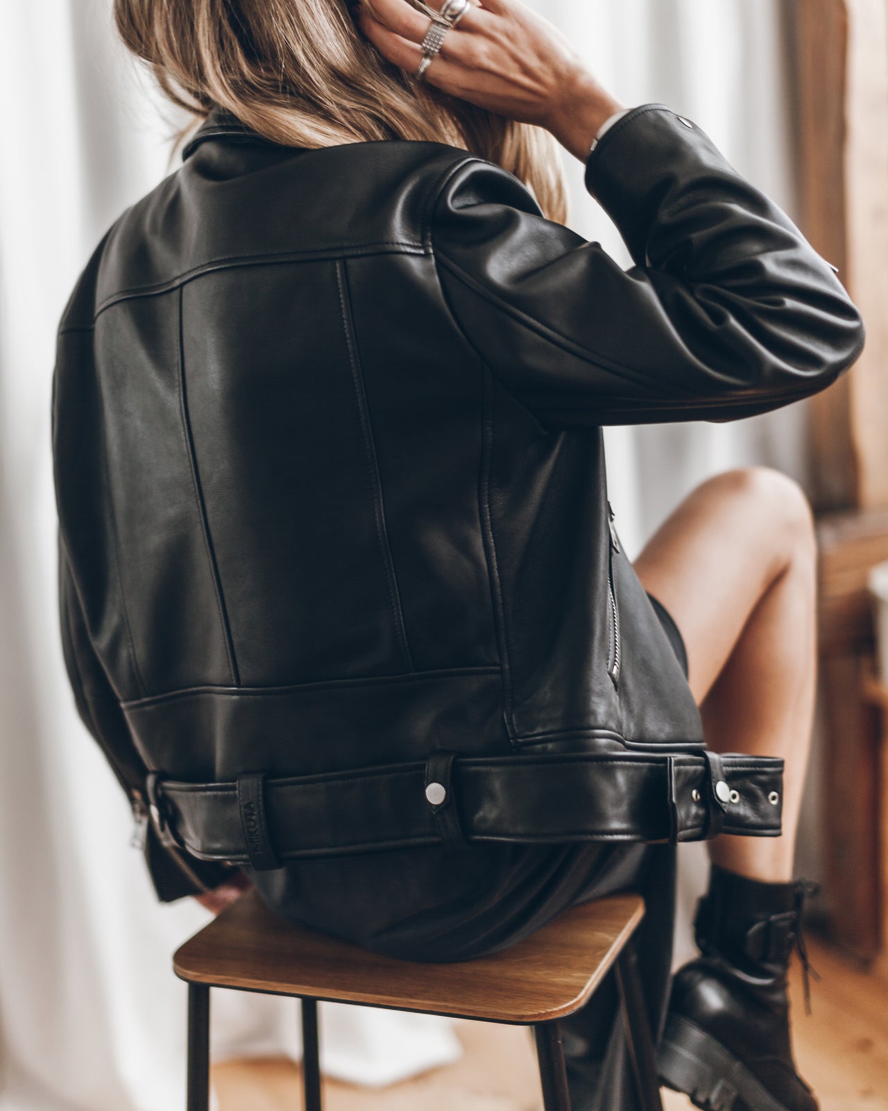 Black leather moto jacket detail - quality leather craftsmanship